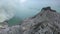 Group of tourists are standing near the blue lake and a mountain, 4k