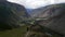 A group of tourists-travelers walks along the Katu-Yaryk pass with stunning views of the Chulyshman valley. Travel to Altai