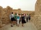 Group of tourists visiting King Herod Palace, Masada Fortress, Judaean Desert, Israel