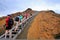 Group of tourists walking on a boardwalk on Bartolome island, Ga