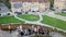 Group of tourists walking down the stairs in a park. Sightseeing in Europe