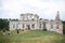 Group of tourists walking to old ruins of Skala Podilskyi castle, Ukraine. Destroyed ruined stone walls of medieval castle and