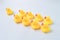 Group of toy ducks follow the leader. Teamwork and cooperation concept