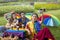 Group of transgender and homosexual people taking selfie and celebrating LGBTQ+ pride month in colorful dress and rainbow flag