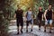 Group of traveler young friends walking and talking together at rain forest,Enjoying backpacking concept