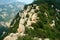 A group of travelers are climbing the steep songshan shaoshi mountain in China