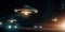 A group of UFOs hovering above a road while cars pass at night