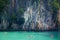 Group of unidentified people swimming in paradise lagoon