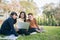 Group Of University Students asian sitting on the green grass W