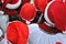 Group of unrecognizable teenagers  dressed as Santa Claus
