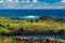 Group of unrecognizable tourists visit ruined moai platform