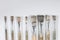 Group of used painting brushes on white background