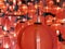 Group of various sizes vivid red round Chinese style lanterns hangs in beautiful random order with one big size in the foreground