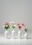 Group Of Vases With Flowers Isolated On A White Background. Generative AI