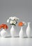 Group Of Vases With Flowers Isolated On A White Background. Generative AI