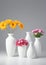 Group Of Vases With Flowers Isolated On A White Background. Generative AI