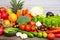 Group vegetables and Fruits Apples, grapes, oranges, pineapples, bananas in a wooden basket with carrots, tomatoes, guava, chili,