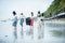 Group of volunteer keep clean on sea beach