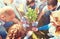 Group of volunteers planting tree in park