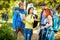 Group of walkers in forest pointing something