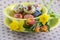 Group of wax painted Easter eggs in green spotted bowl