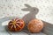 Group of wax painted Easter eggs on light grey tray, wax ornaments, painted flowers, rainbow colors