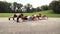 Group of well-trained men and women doing elbow push ups