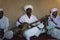 A group of white dressed man playing traditional slave music, kown as Gnawa, in the village of Khamlia