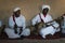 A group of white dressed man playing traditional slave music, kown as Gnawa, in the village of Khamlia