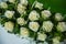 Group of white roses at a wedding