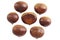 Group of and Whole Chestnuts Isolated on a White Background