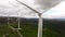 A Group of Windmills in a Field