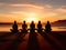 Group of womans practicing yoga during surrealistic sunset at the seaside