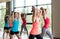 Group of women with dumbbells in gym