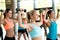 Group of women with dumbbells in gym