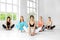 A group of women are engaged in stretching in the gym. The concept of sports, healthy lifestyle, fitness, stretching