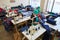 A group of women in a factory seamstress sew special clothes for