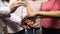 Group of women in pink shirts putting hands together, gender equality, feminism