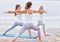 Group of women practising asana exercise Virabhadrasana Warrior Pose