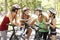 Group Of Women Resting During Cycle Ride Through Park