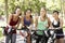 Group Of Women Resting During Cycle Ride Through Park