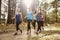 Group of women runners walking in a forest talking, close up