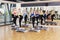 Group of women, step aerobics in fitness club