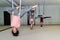 Group of women three hang in a hammock upside down. Fly yoga class. Healthy lifestyle, healthy hobby