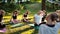 Group of women tilt neck in park on summer sunny morning under guidance of coach