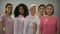 Group of women wearing pink clothes and ribbons, fighting against breast cancer