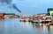 Group of wooden fishery boats stop at the estuary habour.