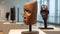 A group of wooden sculptures on display in a museum. Generative AI image.