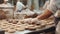 group of workers in a bakery, preparing cookies with various kitchen tools and equipment in a professional setting