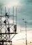 Group of workers are climbing poles to install billboards